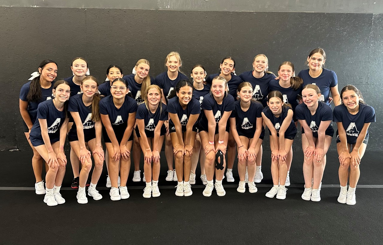 Picture of AAHS Cheer Team girls in blue Air Academy cheer t-shirts 
